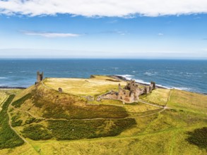 Dunstanburgh Castle from a drone, Northumberland Coast, England, United Kingdom
