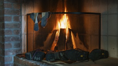 Cosy fireplace with fire to dry wet socks and shoes, hostel on the Olavsweg or Olavsleden