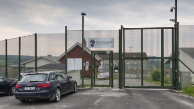 Locked entrance with fence and Tor tor to a prison, near Eidsvoll, Norway