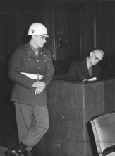 Nuremberg Trials, main war criminals, an American soldier observes the defendant v. Ribbentrop.