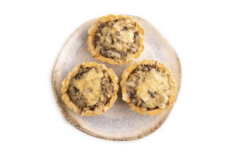 Tartlets with meat and cheese isolated on white background. top view, flat lay, copy space
