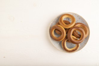 Homemade Ring Bagel on white wooden background. top view, flat lay, copy space
