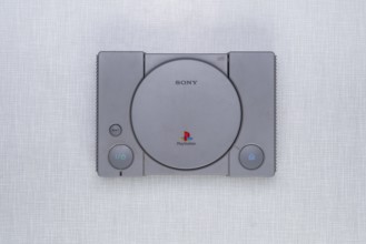 Top shot of a Playstation 1 on a white Resopal board