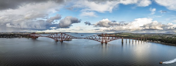 Panorama of Rain clouds over Forth Bridge from a drone, Queensferry Crossing, Forth Estuary,