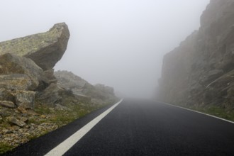 Fog on pass road Alpine pass Colle del Col de Nivolet, Gran Paradiso National Park, Ceresole Reale,