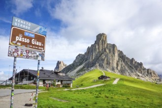 Sign at the top of the Alpine pass road Passo Giau, on the right summit of Monte Gusela Ra Gusela,
