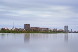View over the Weser to the Überseestadt, long exposure, Bremen, Germany