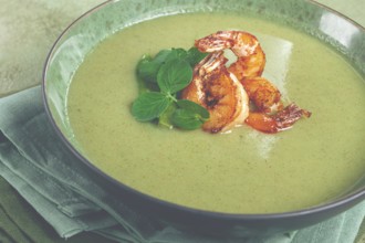 Pea cream soup, with shrimp, green soup, homemade, top view, no people