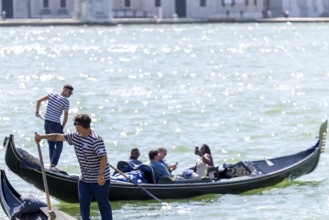Venice, Italy - 3 September 2025: Gondolier on a gondola in Venice during the 82nd Venice