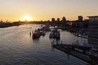 Hamburg harbour, view from the Elbphilharmonie over the Elbe at sunset, jetty, cranes of the