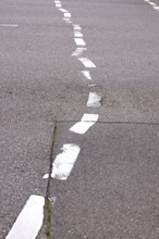 Displaced road markings, symbolic image of need for renovation, Germany