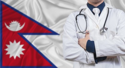 Male doctor with stethoscope on Maldivian flag. Doctor holding stethoscope on Maldives flag