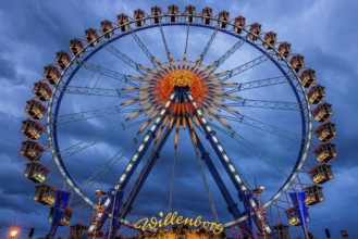 Dark clouds behind the illuminated Ferris wheel, Festwiese, Theresienwiese, Oktoberfest, Munich,