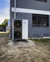 An air heat pump in the front garden of a renovated detached house in Düsseldorf, Germany