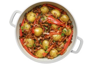 Golden baby potatoes are roasted with vibrant red peppers and crispy bacon isolated on white