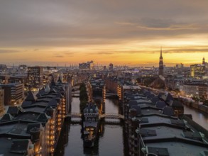 Aerial view of the Speicherstadt Hamburg with evening lighting and view over the harbour with