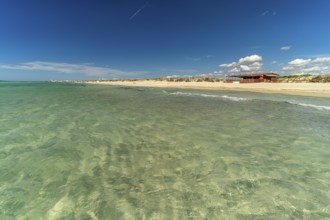 Crystal-clear turquoise water on the beach at Torre San Giovanni, Marina di Ugento, Apulia, Italy