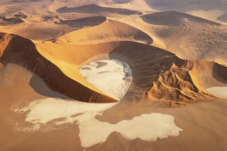Sand dunes and dry pans in the Namib Desert. In the evening. Aerial view. Namib-Naukluft Park,