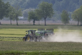 Tractor driving with slurry tanker, meadow, dust, drought, summer, Alpine foothills, Bad-Tölz