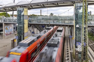 Railway station with passing S-Bahn in Walldorf-Wiesloch. Wiesloch, Baden-Württemberg, Germany