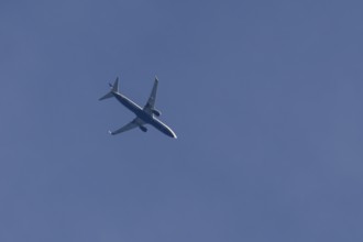 Boeing 737 jet passenger aircraft of Ryanair airlines flying in a blue sky, England, United Kingdom