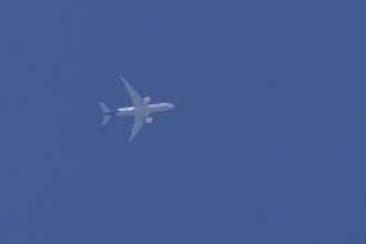 Airbus A300-600RF jet aircraft of FedEx Express airlines in flight in a blue sky, England, United