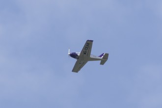 Alpi Pioneer 300 light aircraft flying in a blue sky, England, United Kingdom