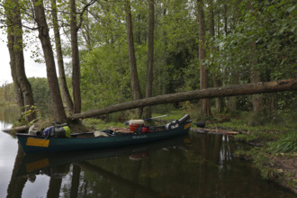 Canoe by nature photographers in Drosedower Bek, Müritz National Park, Mecklenburg-Western