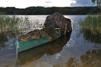 Kayak of a nature photographer in the water, Müritz National Park, Mecklenburg-Western Pomerania,