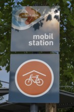 Sign with lettering and logo, mobil.North Rhine-Westphalia, mobil station, Covered bicycle parking,