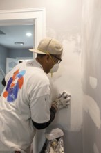 Detroit, Michigan - Workers remodel a house in the Morningside neighborhood that had been vacant