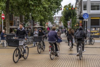 Cycling in the city centre of Groningen, old town, Netherlands