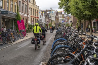 Ride your bike in the city centre of Groningen, old town, designated areas where bikes may be