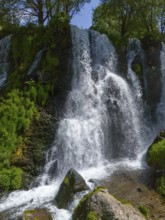 Close-up of a waterfall with splashing water and moss, aerial view, Shaki waterfall, Shaki, Syunik