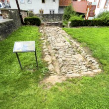 Archaeological find of original small section with old stones from historic trade route between