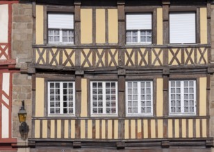 Close-up of a half-timbered house with beige and brown elements, Tréguier, Brittany, France