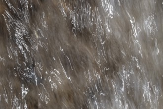 Close-up of moving water with a pattern of light and shadow, light trails, long exposure, North