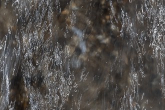 Close-up of moving water with a pattern of light and shadow, long exposure, North Sea, Denmark