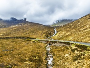 Eas a' Bhradain Waterfall from drone, Red Cuillin mountains, Loch Ainort, Isle of Skye, Scotland,