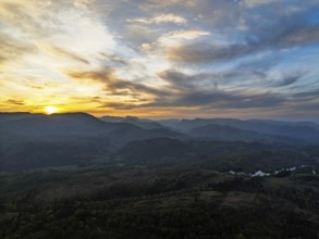 Sunset over Mountains and Coniston Water from drone, Lake District National Park, Cumbria, England,