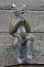 Sculpture Devil by Rolf Goerler 1999 sitting on the Devil's Stone, bronze sculpture, modern art, St