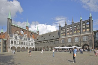 Renaissance and Gothic town hall and pedestrians, tourists, Brick Gothic, brick buildings, market,