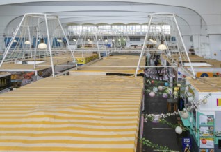Raised view over roofs of market stalls in Market Building or Pannier Market, city of Plymouth,