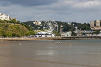 View to Princess Theatre and Ferris Wheel, Torre Abbey Sands sandy beach, Torquay, Devon, England,