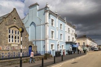 Dark storm clouds pass over historic buildings, Queen Street, Newton Abbot, Devon, England, UK