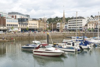Boats at moorings in marina from Vaughan Parade, Torquay, Devon, England, UK