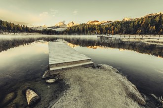 Lake Staz near Sankt Moritz in the Engadin in Switzerland. Morning atmosphere with fog in autumn.