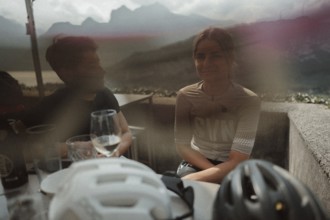 Young man taking a coffee break while riding his racing bike on Lake Garda. Sunny weather and dolce