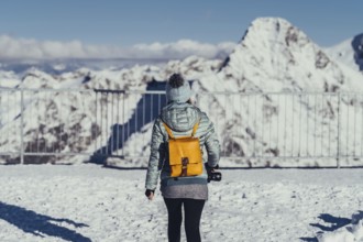 Woman in wintry surroundings in the Engadine in Switzerland