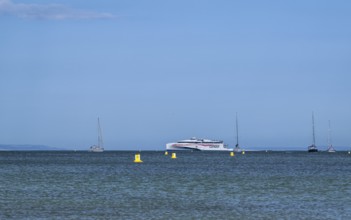 Boats on sea over Knoll Beach Studland, Poole, Dorset, England, United Kingdom